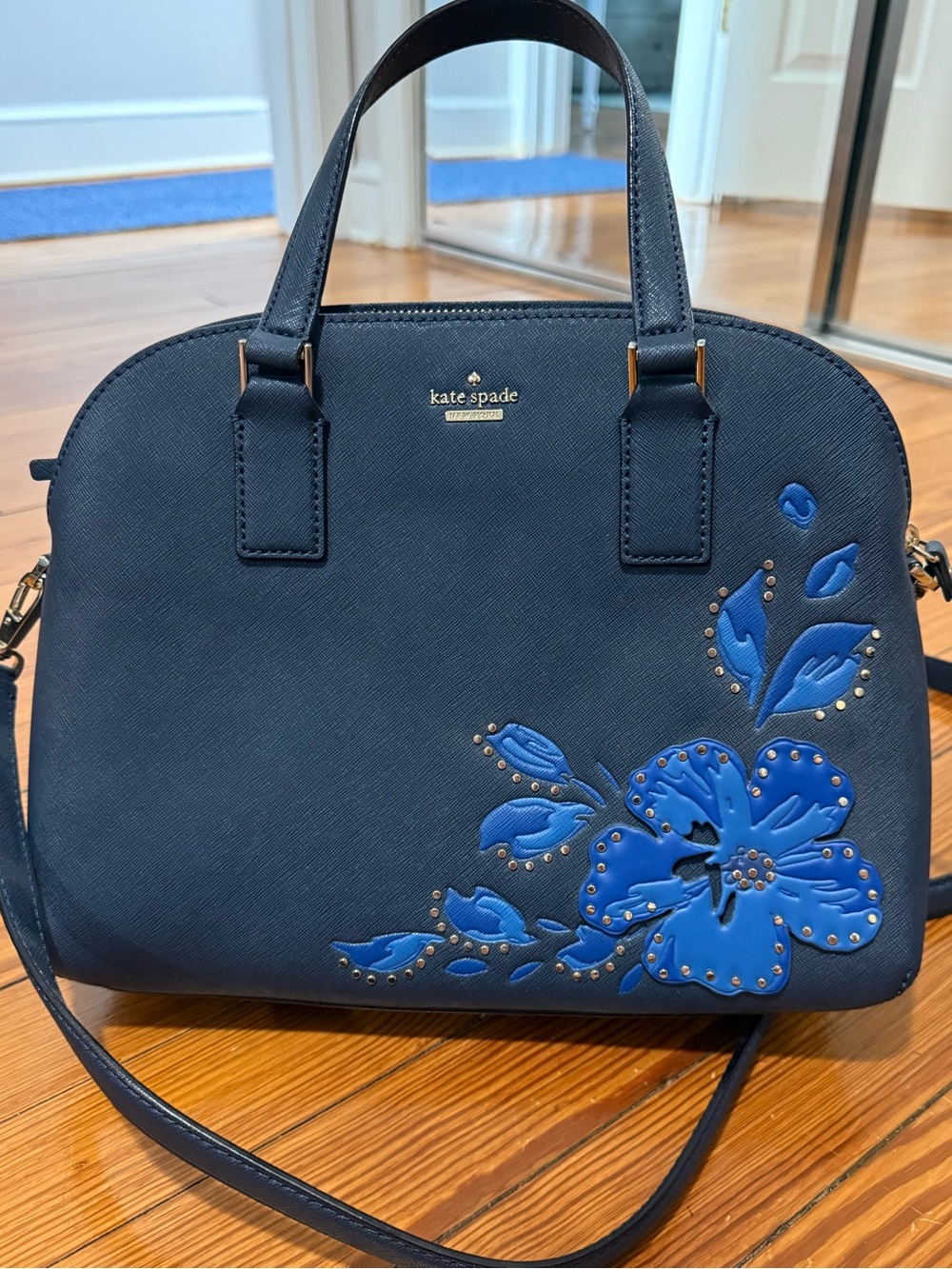kate spade navy satchel with blue floral appliqué